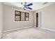 Bedroom with ceiling fan and window, ready to be customized at 5419 Ahyoka Dr, Morrow, GA 30260
