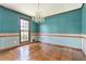 Dining room featuring hardwood floors and a decorative chandelier at 5419 Ahyoka Dr, Morrow, GA 30260