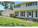 Two-story home with black shutters, an attached two-car garage and a simple, landscaped front yard at 5419 Ahyoka Dr, Morrow, GA 30260
