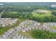 Community aerial view highlighting its proximity to a park, surrounded by lush greenery and walking trails at 1459 Bennett Creek Ovlk, Suwanee, GA 30024