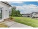 Picture showcasing a well-maintained lawn, concrete patio, and partial view of the fenced backyard, perfect for outdoor enjoyment at 1459 Bennett Creek Ovlk, Suwanee, GA 30024