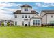 Expansive backyard featuring a large manicured lawn and black metal fence providing privacy and space for outdoor activities at 1459 Bennett Creek Ovlk, Suwanee, GA 30024