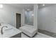 Elegant bathroom with double sinks, a glass-enclosed shower, and a comfortable bench, creating a spa-like experience at 1459 Bennett Creek Ovlk, Suwanee, GA 30024