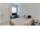 Neutral bedroom with a cozy bed, desk and ample closet space at 1459 Bennett Creek Ovlk, Suwanee, GA 30024