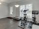 Bonus room with hardwood floors, a window, and space for exercise equipment at 1459 Bennett Creek Ovlk, Suwanee, GA 30024
