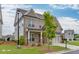 A brick two-story home with landscaped front yard, a two-car garage, and a covered porch at 1459 Bennett Creek Ovlk, Suwanee, GA 30024