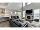 Spacious living room with fireplace open to kitchen with modern, neutral decor at 1459 Bennett Creek Ovlk, Suwanee, GA 30024
