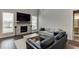 Cozy living room with a fireplace, large windows, and comfortable seating at 1459 Bennett Creek Ovlk, Suwanee, GA 30024