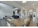 Open floorplan of the dining room, kitchen, and living room; featuring hardwood floors and neutral paint at 1459 Bennett Creek Ovlk, Suwanee, GA 30024