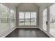 Sunroom features large windows providing ample natural light and backyard views at 1459 Bennett Creek Ovlk, Suwanee, GA 30024