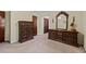 Bedroom featuring dark wood dresser and matching mirror at 2880 Sherwood Se Rd, Smyrna, GA 30082