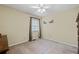 Neutral bedroom featuring a ceiling fan, natural light, and wall decorations at 2880 Sherwood Se Rd, Smyrna, GA 30082