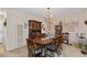 Traditional dining room with wood table, china cabinet, and decorative chandelier at 2880 Sherwood Se Rd, Smyrna, GA 30082