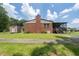 Traditional brick home featuring an outbuilding and a cozy screened-in porch at 2880 Sherwood Se Rd, Smyrna, GA 30082