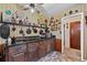 Well-organized kitchen with dark countertops, and classic wooden cabinets at 2880 Sherwood Se Rd, Smyrna, GA 30082