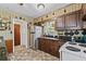 Cozy kitchen with stainless steel appliances, dark countertops and traditional wooden cabinets at 2880 Sherwood Se Rd, Smyrna, GA 30082