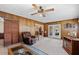 Spacious living room with wood paneling, carpet, access to other rooms and backyard at 2880 Sherwood Se Rd, Smyrna, GA 30082