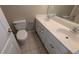 Bright bathroom featuring dual sinks and a toilet at 3618 Prescot Way, Douglasville, GA 30135