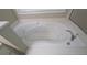 Close up of a large white soaking tub with jets and chrome fixtures in the bathroom at 3618 Prescot Way, Douglasville, GA 30135