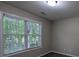 Cozy bedroom with a window overlooking a wooded lot at 3618 Prescot Way, Douglasville, GA 30135
