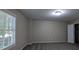 Bedroom with carpet, neutral paint, and large window at 3618 Prescot Way, Douglasville, GA 30135