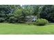 Charming two-story home nestled among mature trees, set back on a grassy lot at 3618 Prescot Way, Douglasville, GA 30135