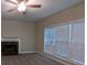 Bright living room featuring a fireplace and large windows with blinds for ample natural light at 3618 Prescot Way, Douglasville, GA 30135