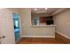 Inviting living space with hardwood floors and kitchen in the background at 3618 Prescot Way, Douglasville, GA 30135