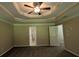 Spacious main bedroom featuring a ceiling fan and ensuite bathroom at 3618 Prescot Way, Douglasville, GA 30135