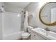 Bathroom with a shower/tub combination and a vanity with a gold mirror at 1029 Megan Ct, Sugar Hill, GA 30518