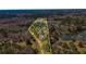 Large wooded lot with lake frontage and a long driveway leading to the main house at 166 Muse Rd, Fayetteville, GA 30214