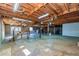 Unfinished basement with exposed ceiling, stairs, and a walkout door at 166 Muse Rd, Fayetteville, GA 30214