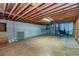 This basement has exposed beams and concrete walls at 166 Muse Rd, Fayetteville, GA 30214