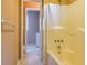 Bathroom with shower-tub combo and tile flooring at 166 Muse Rd, Fayetteville, GA 30214