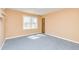 This is a bedroom with carpet and bright light from the window at 166 Muse Rd, Fayetteville, GA 30214