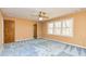 Bedroom with blue carpet, ceiling fan, double hung windows providing natural light at 166 Muse Rd, Fayetteville, GA 30214