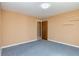 Bedroom with blue carpet and a visible door to the next room at 166 Muse Rd, Fayetteville, GA 30214