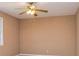 Bedroom features a ceiling fan, carpet flooring, and window at 166 Muse Rd, Fayetteville, GA 30214