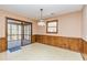 Light-filled dining area with sliding glass doors leading to a screened porch at 166 Muse Rd, Fayetteville, GA 30214