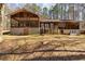 Home exterior with block foundation and lush backyard at 166 Muse Rd, Fayetteville, GA 30214