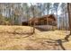 Exterior view of home with mature trees and hillside yard at 166 Muse Rd, Fayetteville, GA 30214