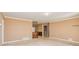 Open living room featuring neutral carpeting, tan walls, and light trim at 166 Muse Rd, Fayetteville, GA 30214