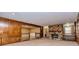 Spacious living room featuring a stone fireplace, wooden trim, and access to the dining room at 166 Muse Rd, Fayetteville, GA 30214