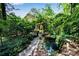 Beautiful backyard featuring a serene pond and stone pathway at 3152 Sycamore Ln, Marietta, GA 30066