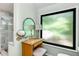 Bathroom with a vanity, frosted window, and a glass-enclosed shower at 3152 Sycamore Ln, Marietta, GA 30066