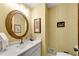 Stylish half bathroom featuring decorative mirror, lighting, and elegant design at 3152 Sycamore Ln, Marietta, GA 30066