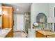 Bathroom featuring walk-in shower, mosaic tile floor and wooden vanity at 3152 Sycamore Ln, Marietta, GA 30066
