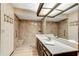 A full bathroom provides a walk-in shower, vanity and modern fixtures at 3152 Sycamore Ln, Marietta, GA 30066