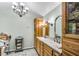 Bathroom featuring dual sinks, ample cabinets, and decorative lighting at 3152 Sycamore Ln, Marietta, GA 30066