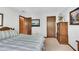 Bedroom featuring neutral walls, a striped bedspread, and warm wood trim at 3152 Sycamore Ln, Marietta, GA 30066